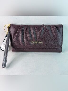 bebe Trifold Clutch Wristlet Wallet in Deep Burgundy with Gold Logo